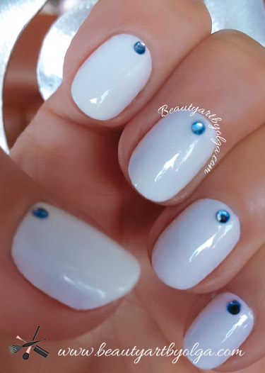 White Manicure with Blue Rhinestones